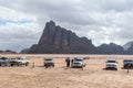 Several jeeps and their drivers are waiting for tourists near Wadi Rum Visitor Center at the entrance to Wadi Rum desert near Aqab Royalty Free Stock Photo