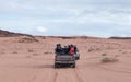 Tourists ride in open jeeps in the Wadi Rum desert Visitor near Aqaba city in Jordan