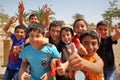 AQABA, JORDAN, MARCH 15, 2016: Welcoming and lively children on a beach