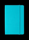 Aqua blue closed notebook isolated on black