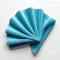 Aqua Blue Microfiber Cloth Folded With Pink Trim On White Background Studio Lighting Royalty Free Stock Photo