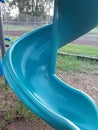 Aqua blue slide in children& x27;s park