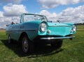 Aqua Car Parked In A Grassy Field Royalty Free Stock Photo