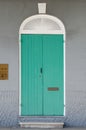 Aqua Door on Gray Wall Royalty Free Stock Photo