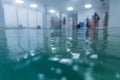 Aqua fitness class beginning. Blurred.