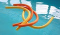 Aqua noodles floating in a indoor swimming pool