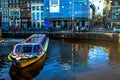 Aqua Odyssey: Amsterdam Canal and Cruise Ship Royalty Free Stock Photo