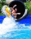 Aqua park fun - man enjoying a water tube ride Royalty Free Stock Photo