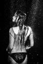 Aqua photo session woman under rain drops black and white studio