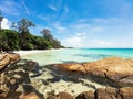 aqua sea water surface waves, big stone on white sandy beaches and clouds, nature blue sky. summer vacations at Samed island Royalty Free Stock Photo