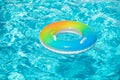 Aqua textured. Pool float, ring floating in a refreshing blue swimming pool on summer background. Royalty Free Stock Photo