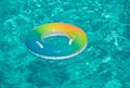Aqua textured. Pool float, ring floating in a refreshing blue swimming pool on summer background. Royalty Free Stock Photo