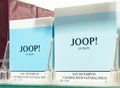 Aqua and white joop! le bain perfume packaging on display shelf Royalty Free Stock Photo