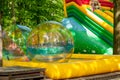 Aqua zorbing. Colorful water walking balls. Water activity for kids. Children playing together and having fun inside large