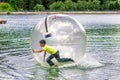 Aqua zorbing on water Royalty Free Stock Photo