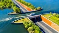 Aquaduct Veluwemeer, Nederland. Aerial view from the drone. A sailboat sails through the aqueduct on the lake above the highway Royalty Free Stock Photo