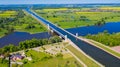 Aquaduct Veluwemeer, Nederland. Aerial view from the drone. A sailboat sails through the aqueduct on the lake above the highway