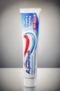 Aquafresh toothpaste isolated on gradient background. Royalty Free Stock Photo