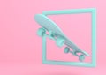 Aquamarine skateboard in a frame on bright pink background