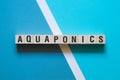 Aquaponics word concept on cubes