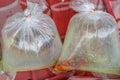 Aquarium fishes packed in a plastic bag for sale in a market in Royalty Free Stock Photo