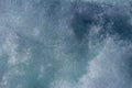 Aquatic background of sea surf waves splashing close up with clear blue green water and white foam Royalty Free Stock Photo