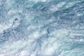 Aquatic background of sea surf waves splashing close up with clear blue green water and white foam Royalty Free Stock Photo