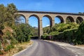 Aqueduct ancient bridge over highway in Fontaine de Vaucluse, Provence, France. Royalty Free Stock Photo