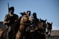 Celtic knights riding horses in traditional costumes