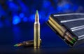 AR-15 ammo and magazine with blue background Royalty Free Stock Photo