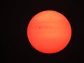 Visible AR3310 sunspot through forest fire smoke black sky