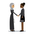 Arab and african american women shake hands