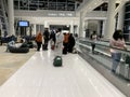 Arab airlines passengers with luggage waiting for check-in through airport building, aircraft flights on electronic scoreboard, Royalty Free Stock Photo