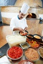 Arab baker chef making Pizza Royalty Free Stock Photo