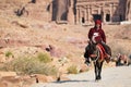 Arab bedouin guide riding in the ancient city of Petra, Jordan