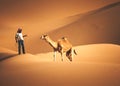 Arab Bedouin man with his camel in the Desert in Abu Dhabi