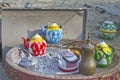 Arab Bedouin nomads use traditional homemade metal tea pots a