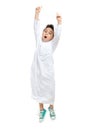 Arab boy jumping high with a big and cheering pose Royalty Free Stock Photo