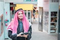 Arab business man standing and working at his market,