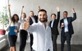 Arab Businessman Gesturing Thumbs Up Standing With Employees In Office