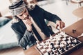 Arab playing chess and planning strategy