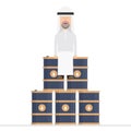 Arab businessman sits on oil barrels