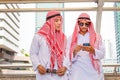 Arab businessman walking outside office, business man is walking through the city street