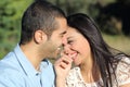 Arab casual couple man and woman flirting and laughing happy in a park