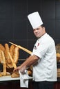 Arab chef cutting bread Royalty Free Stock Photo