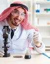 Arab chemist scientist testing quality of oil petrol Royalty Free Stock Photo
