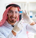 Arab chemist scientist testing quality of oil petrol Royalty Free Stock Photo