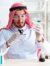 Arab chemist scientist testing quality of oil petrol Royalty Free Stock Photo