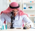 Arab chemist scientist testing quality of oil petrol Royalty Free Stock Photo