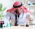 Arab chemist scientist testing quality of oil petrol Royalty Free Stock Photo